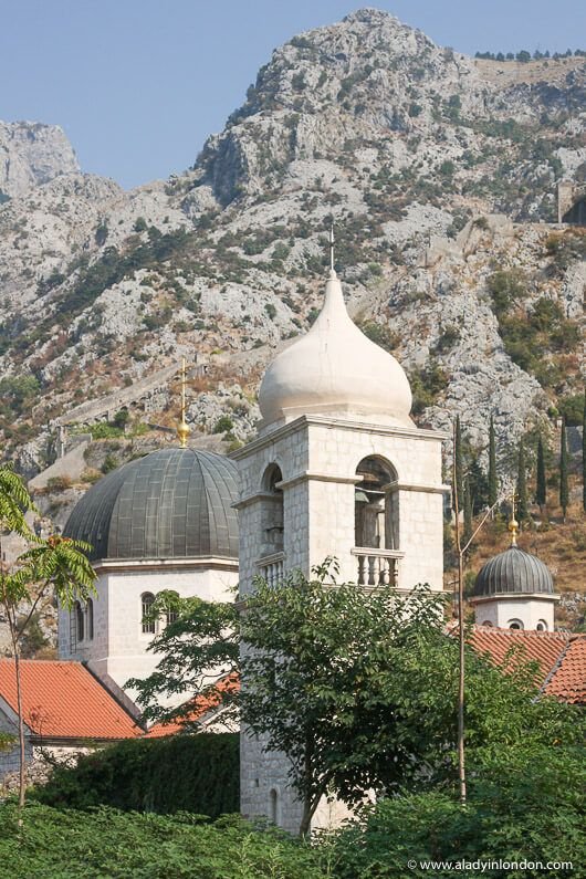 Historic Kotor, Montenegro, with medieval architecture and mountain views.